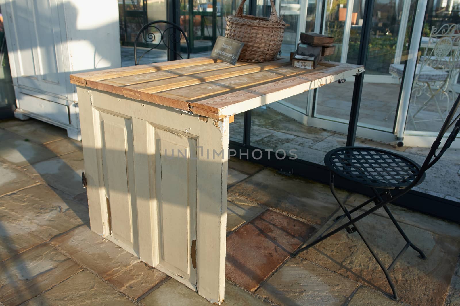 Beautiful creative handmade table made of old wooden doors                                