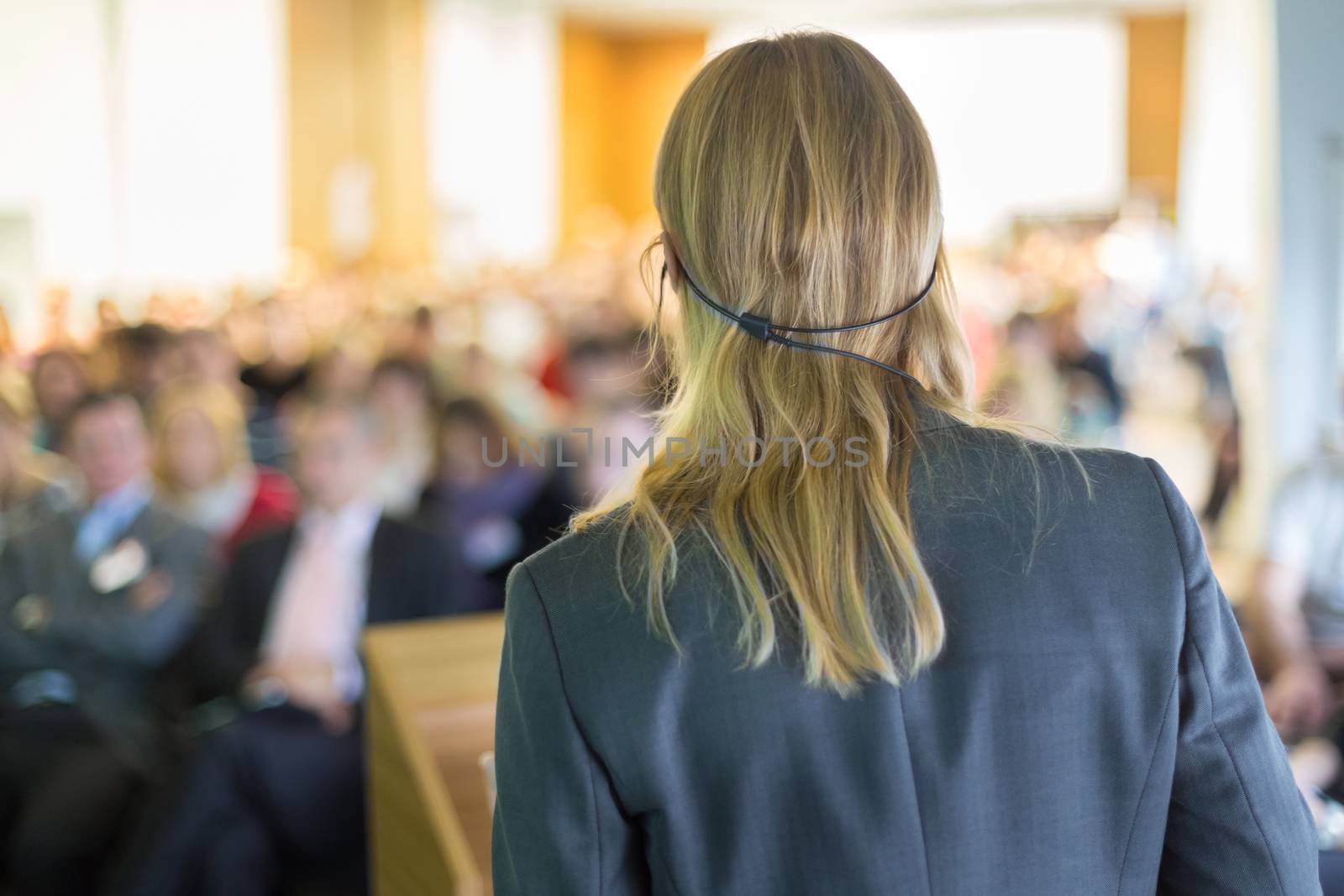 Female speaker at Business Conference and Presentation. Audience at the conference hall. Business and Entrepreneurship. Business woman.