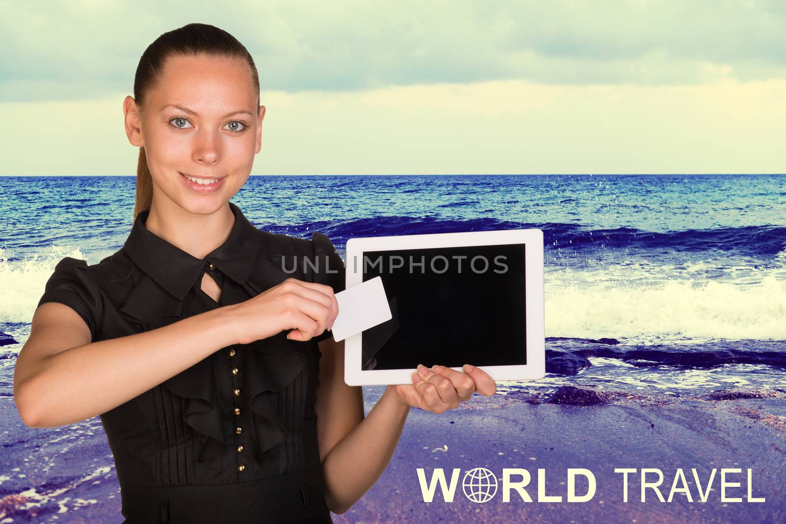 Beautiful businesswoman holding tablet PC and business card in front of screen. Seascape as backdrop by cherezoff