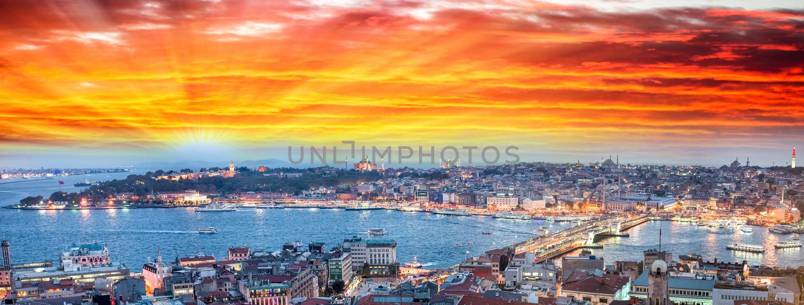 Wonderful panoramic view of Istanbul at dusk across Golden Horn river.