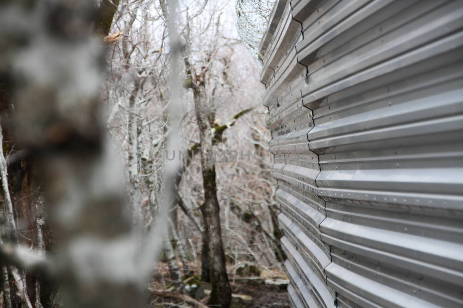 Krasnodar region, Russia - March 23, 2012. Fence villas Governor Tkachev in the protected forest with trees, listed in the Red book