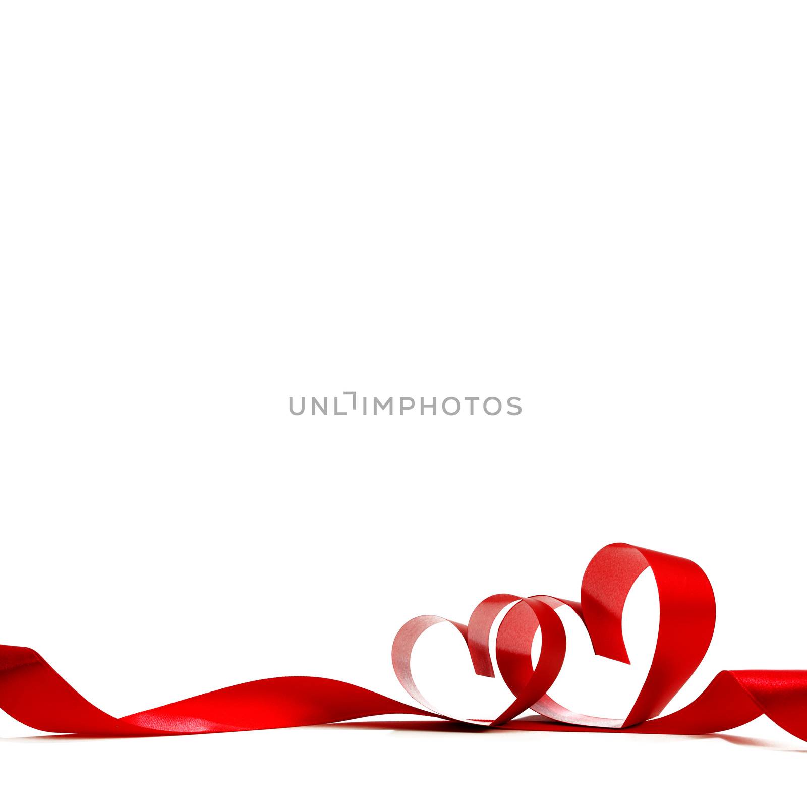 Red heart ribbon bow isolated on white background