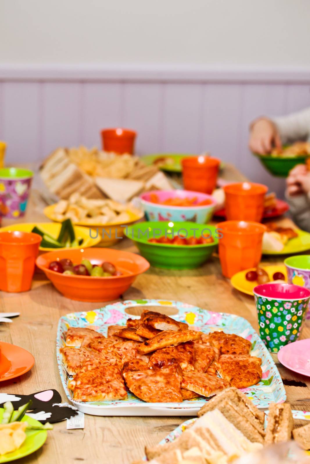 Colorful food and plastic crockery at a children's party