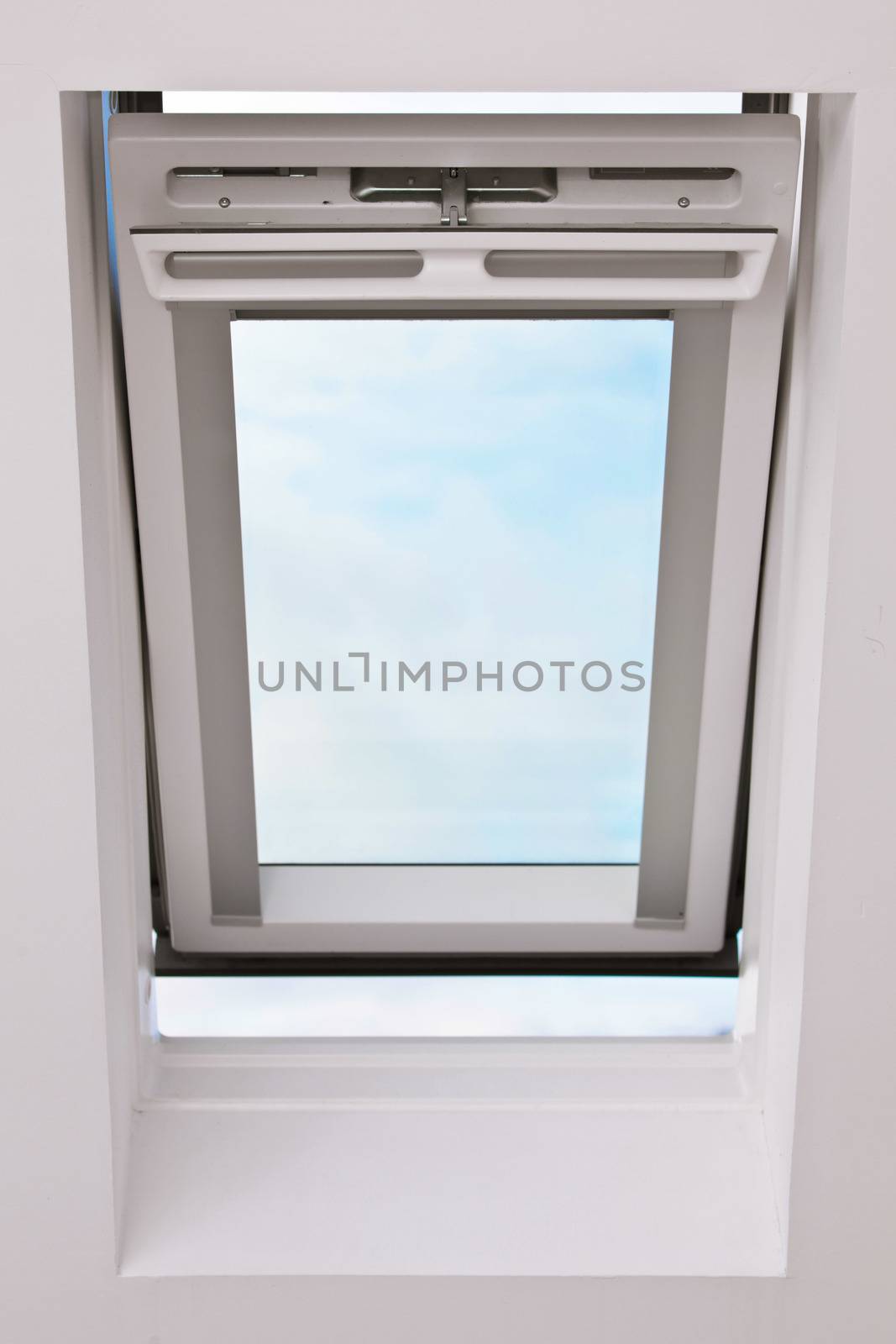 A modern skylight in an attic room