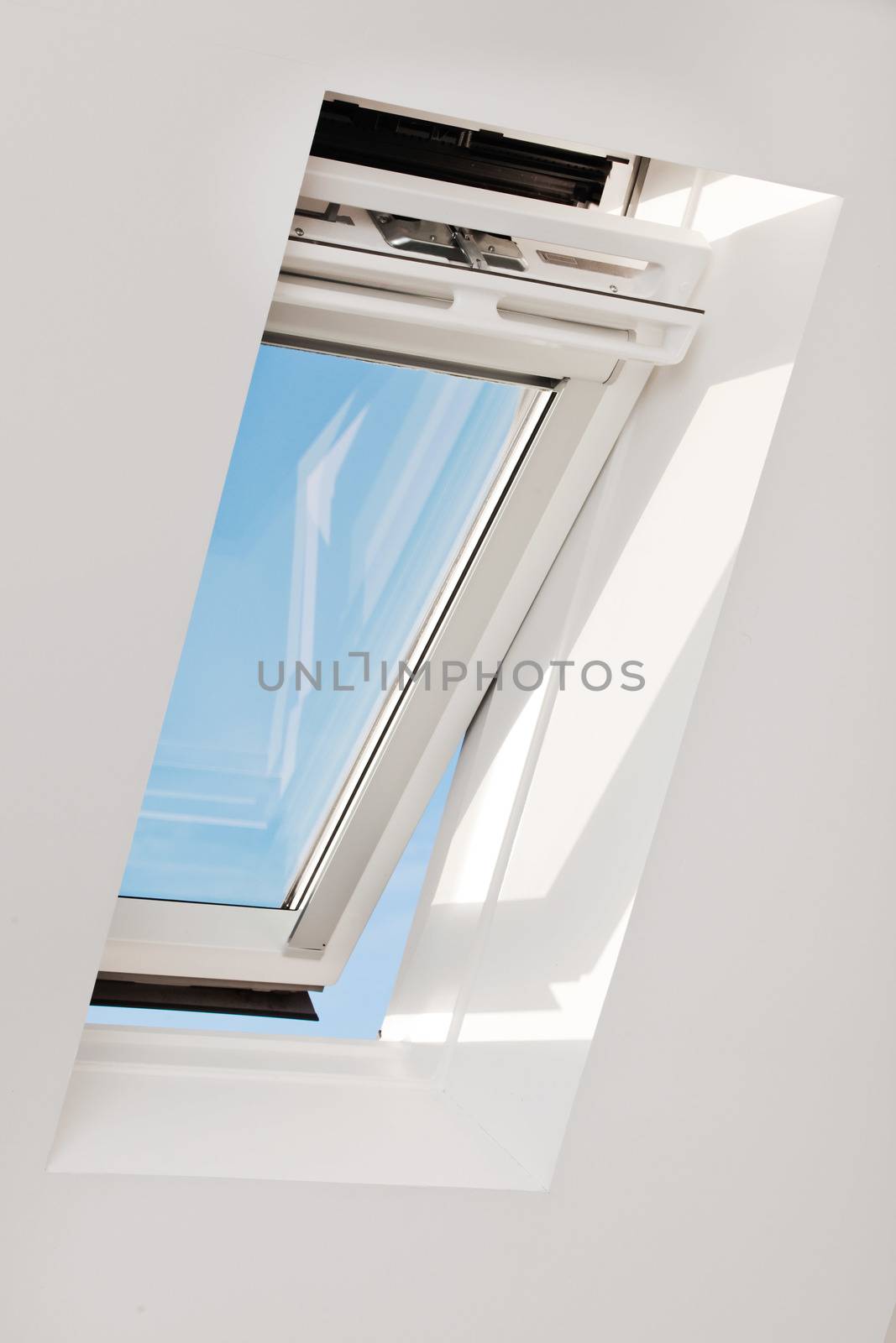 A modern skylight in an attic room