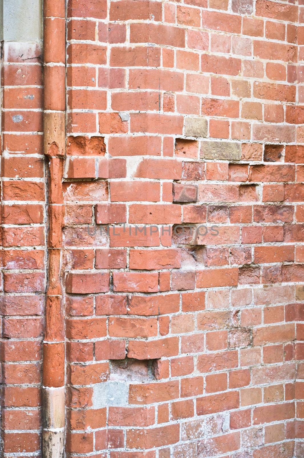 A delapidated brick wall