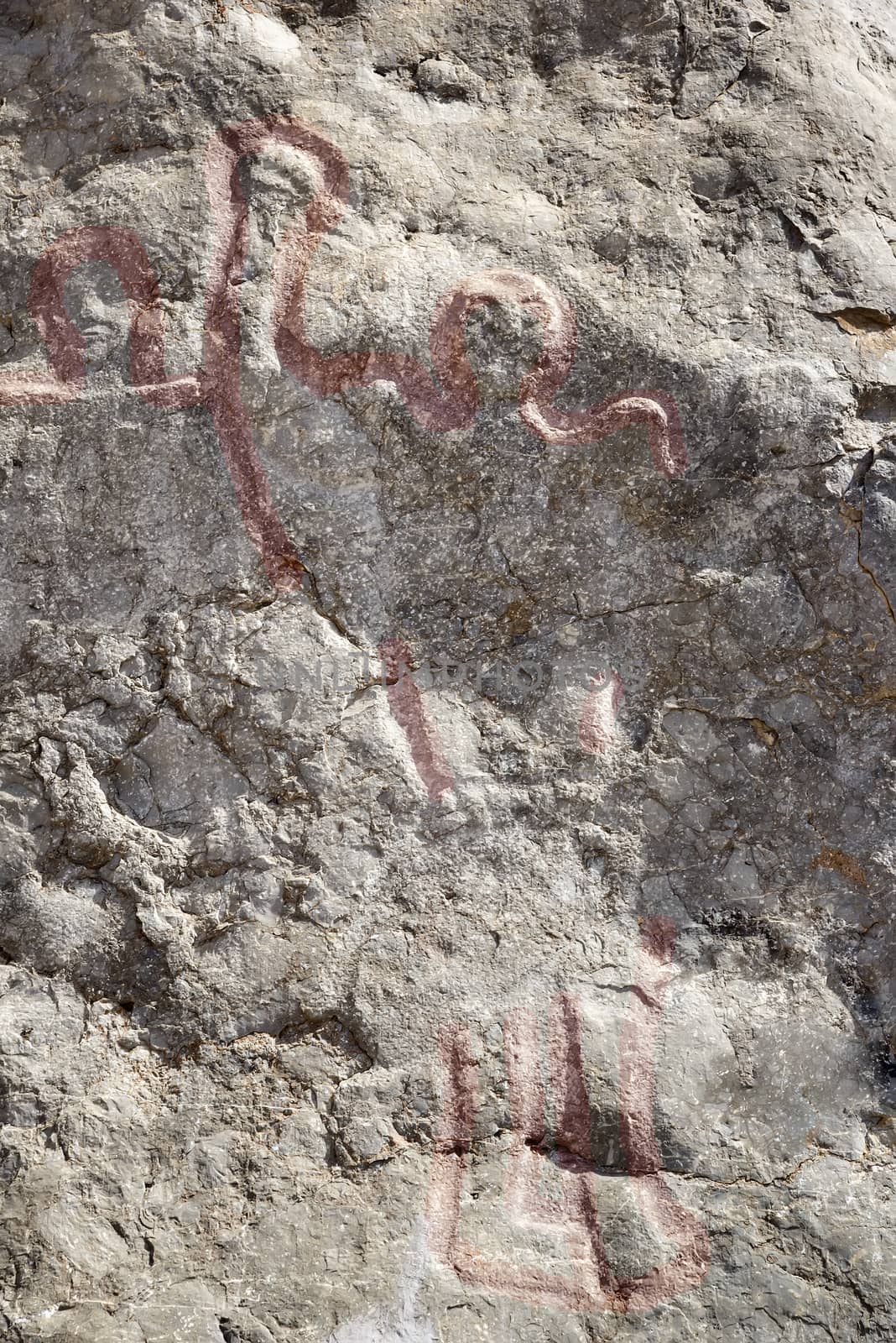 Closeup of the famous Colemans Rock in Oman with highlighted old pictures of people