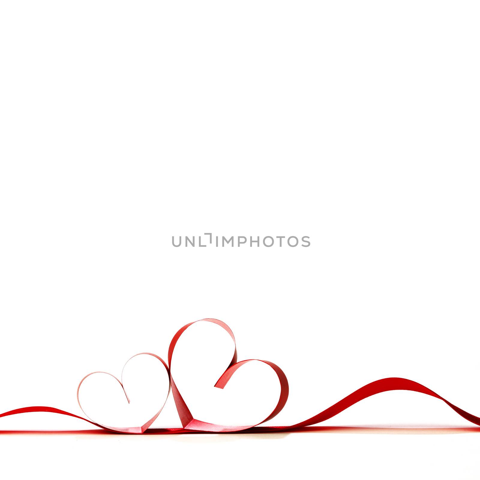 Red heart ribbon bow isolated on white background