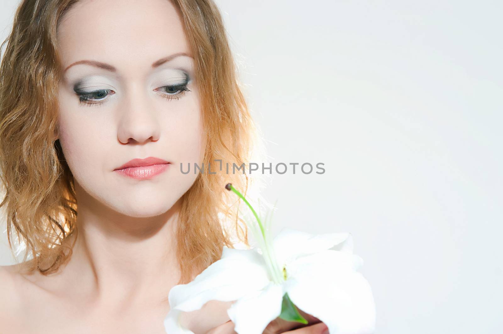 portrait of the girl with a lily flower