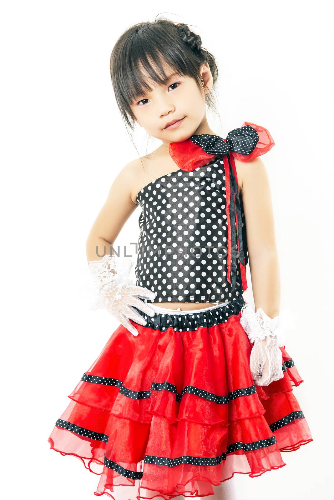 child girl in red suit on white background