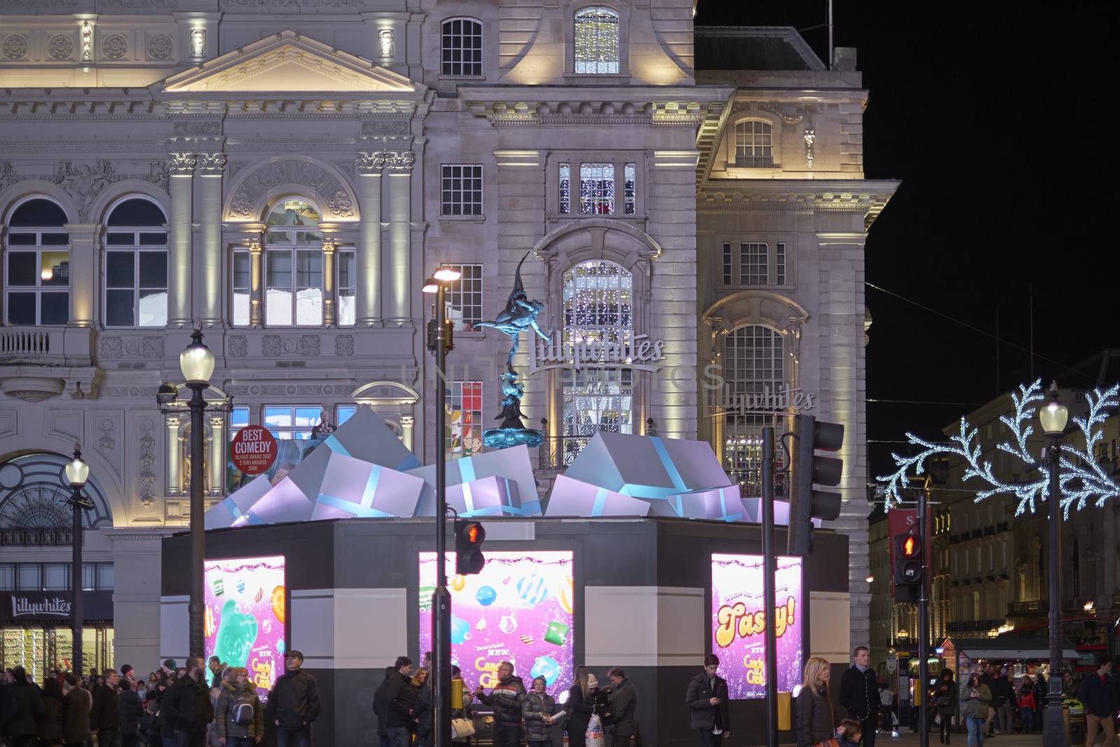 LONDON, UK - DECEMBER 19: Statue of Antheros in Piccadilly Circus surrounded by present boxes. December 19, 2014 in London. Each year there is a new design of Christmas decoration.