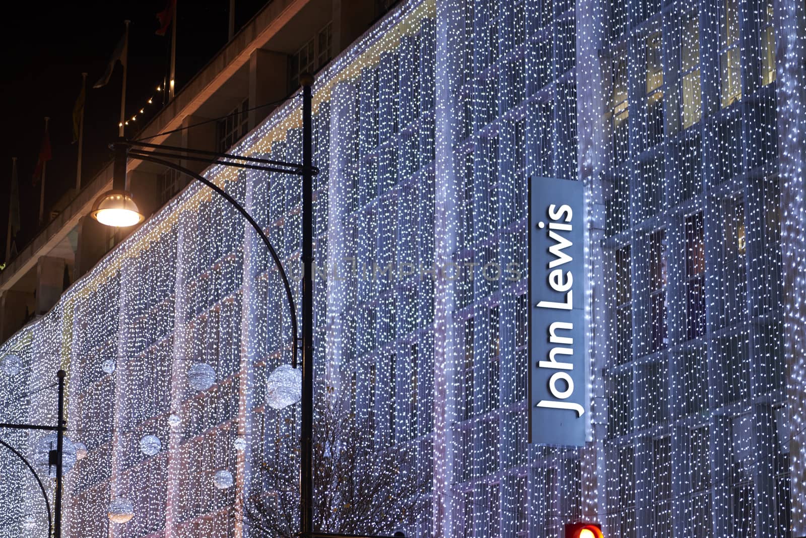 LONDON, UK - DECEMBER 20: Nighttime shot of John Lewis department store with its wall of light as part of its Christmas decoration. December 20, 2014 in London.