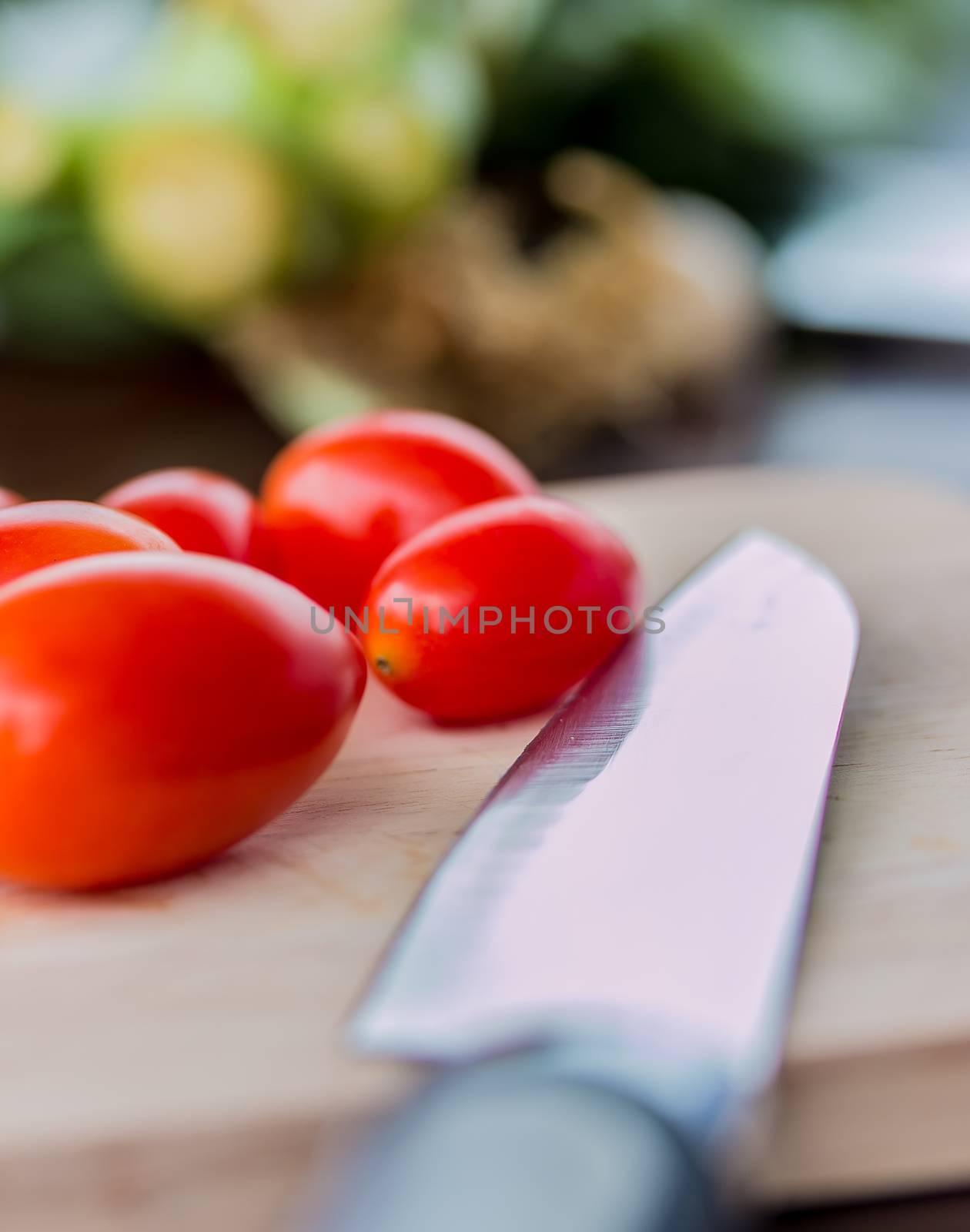 Tomatoes On Board Indicates Fresh Food And Cooking by stuartmiles