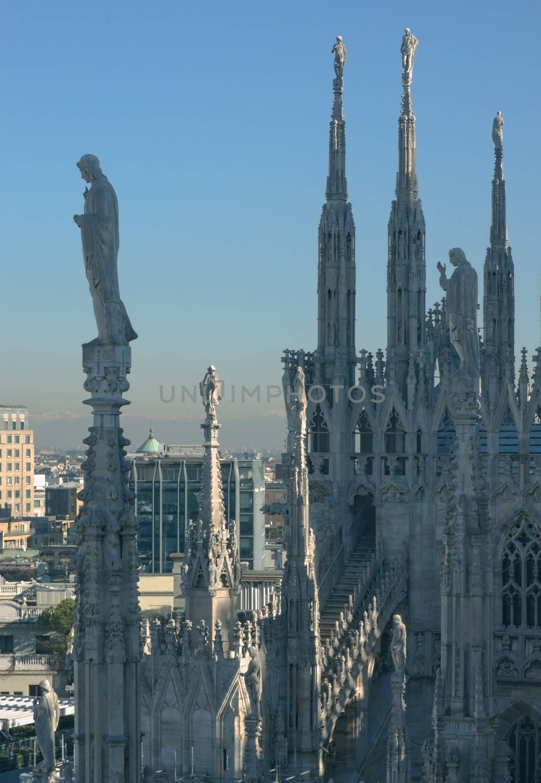 Silhouettes of statues on the roof of the Duomo in Milan