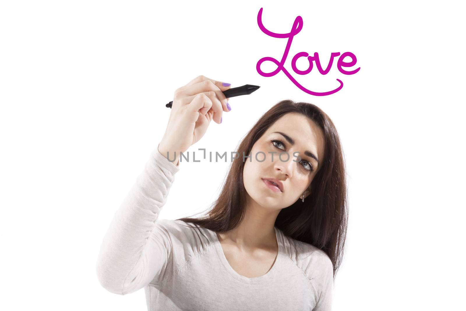 Beautiful healthy girl writing with black marker pen on virtual screen the world Love. Young beautiful girl isolated on white background.