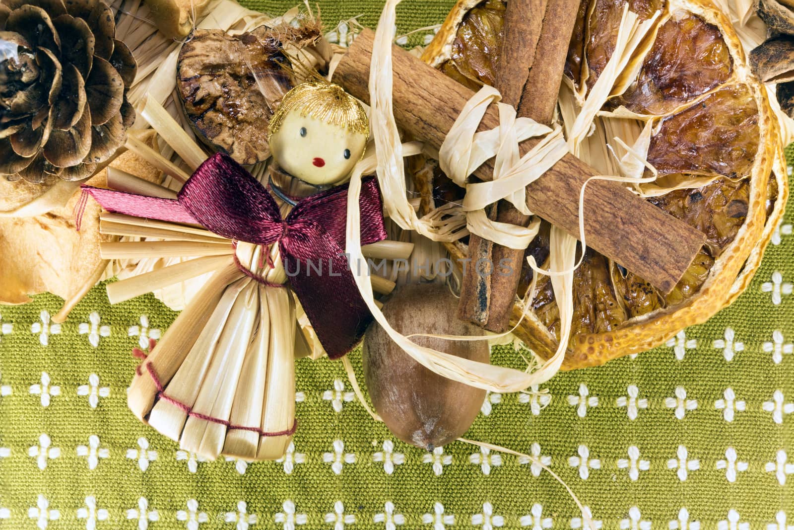 Photo shows a closeup of Christmas decoration from tree and figurine.