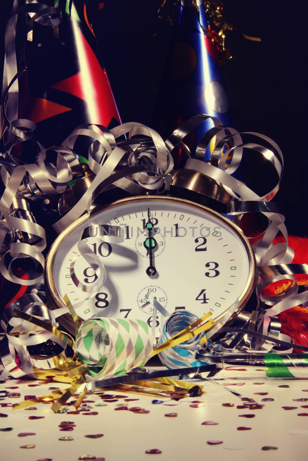 Alarm clock and decorations on table  by Sandralise