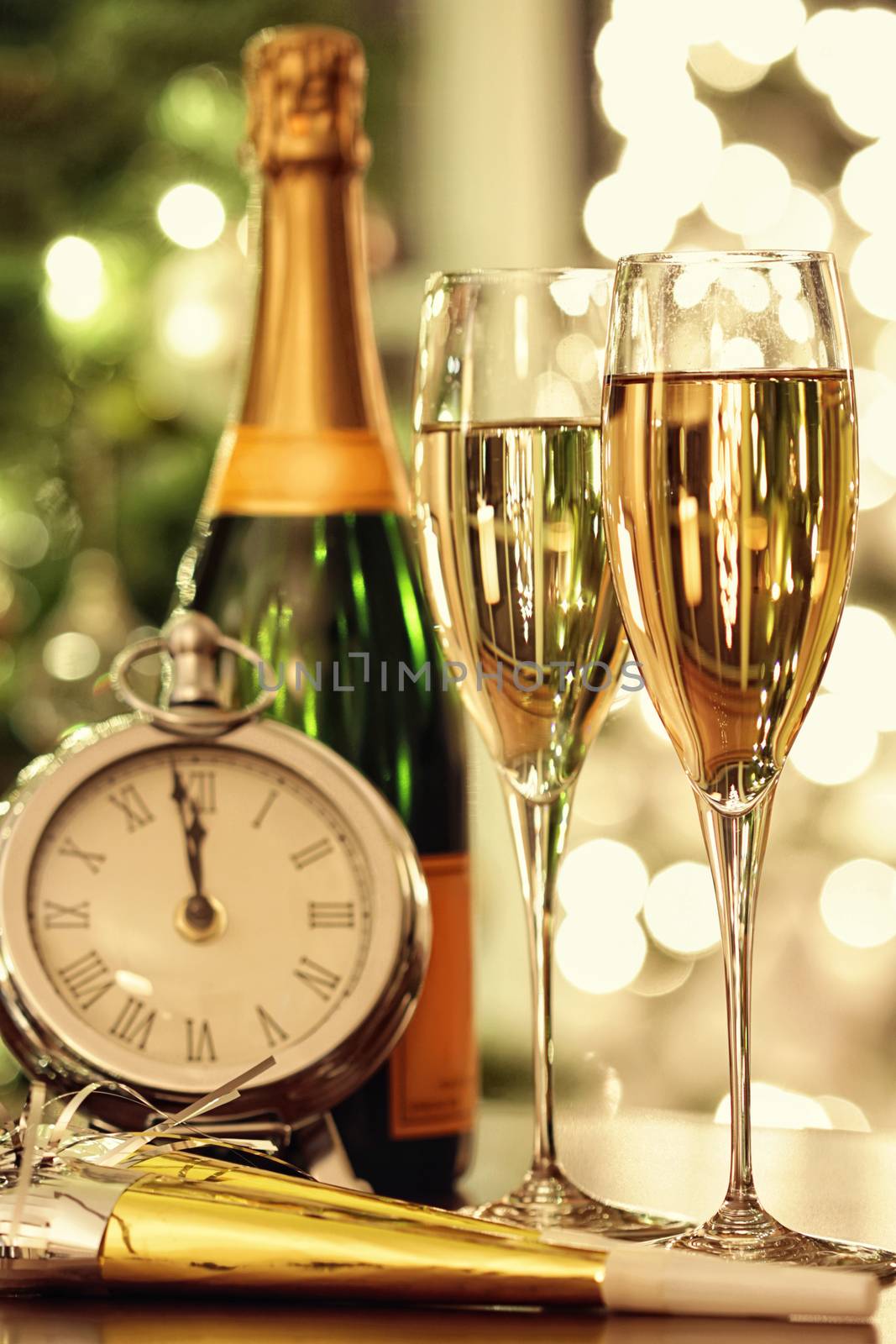 Glasses of champagne with festive background by Sandralise
