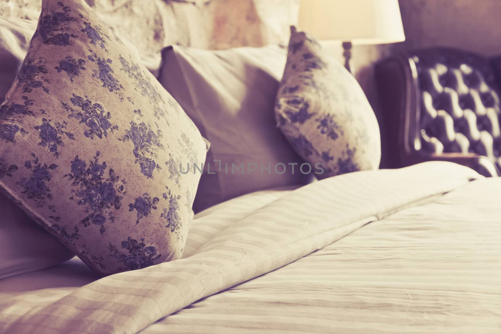 close up image of pillows on an antique luxury bed