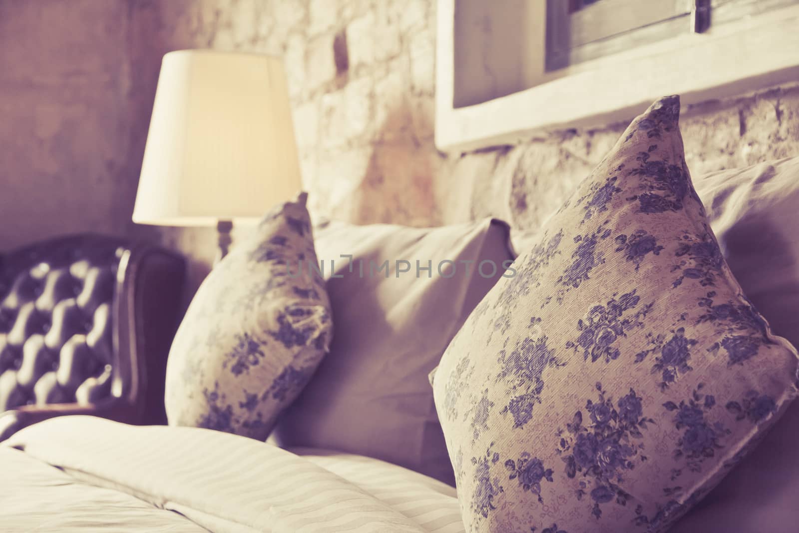close up image of pillows on an antique luxury bed