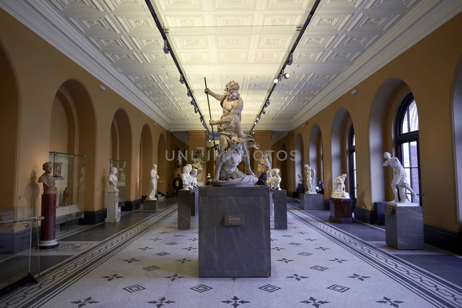 LONDON, UK - DECEMBER 20: Victoria and Albert museum's Medieval and Renaissance room, with statue of Neptune and Triton in the centre. December 20, 2014 in London.