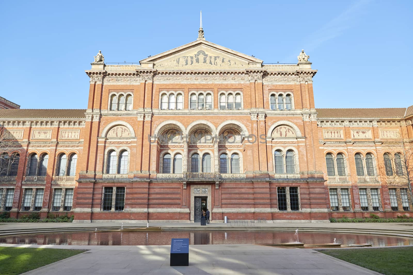 LONDON, UK - DECEMBER 20: Garden entrance to Victoria and Albert museum in bright sunny day. December 20, 2014 in London.