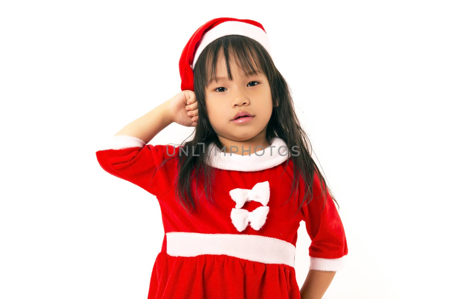 Asian little girl in red santa hat on white background