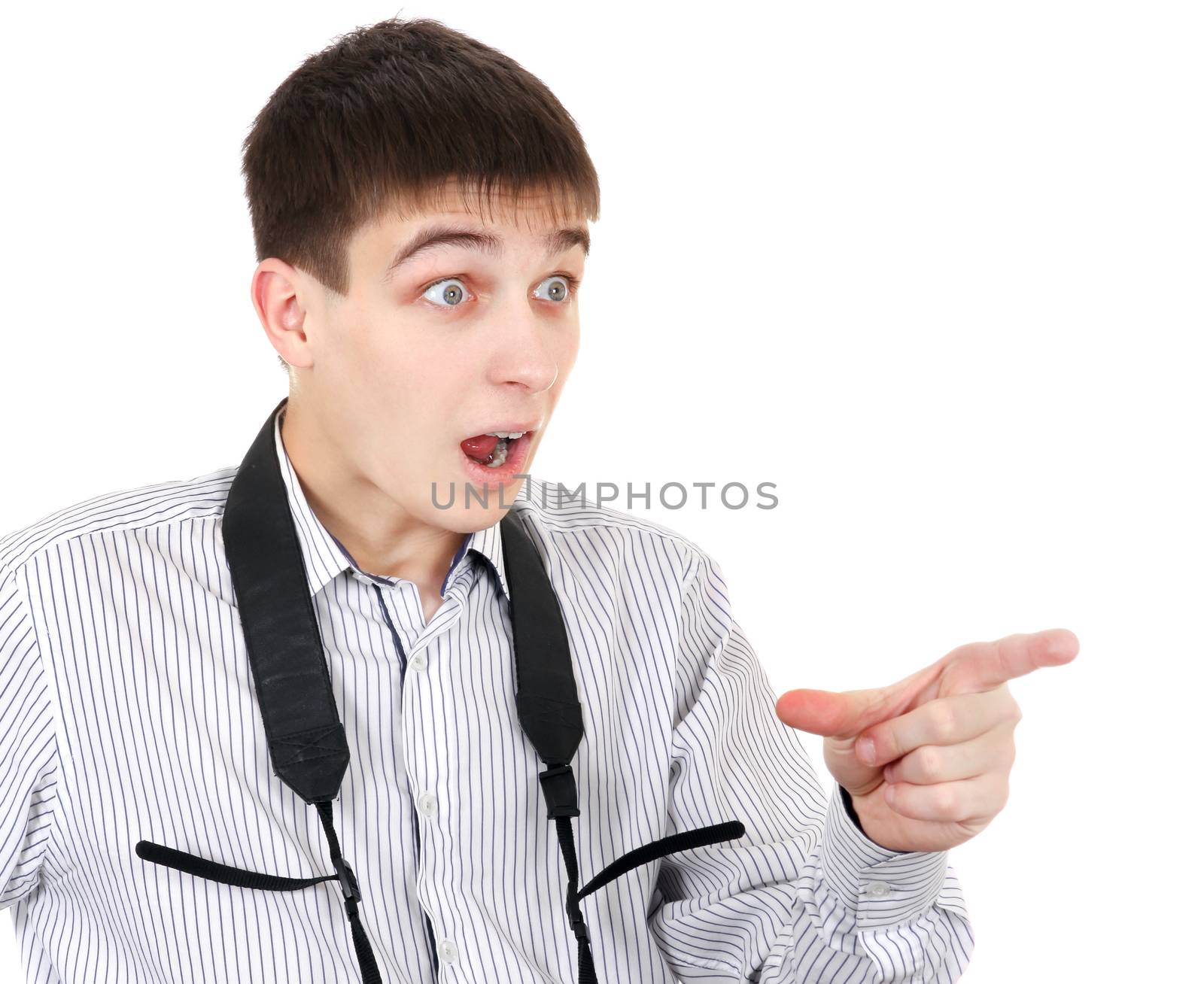 Surprised Teenager looking and pointing outside on the White Background