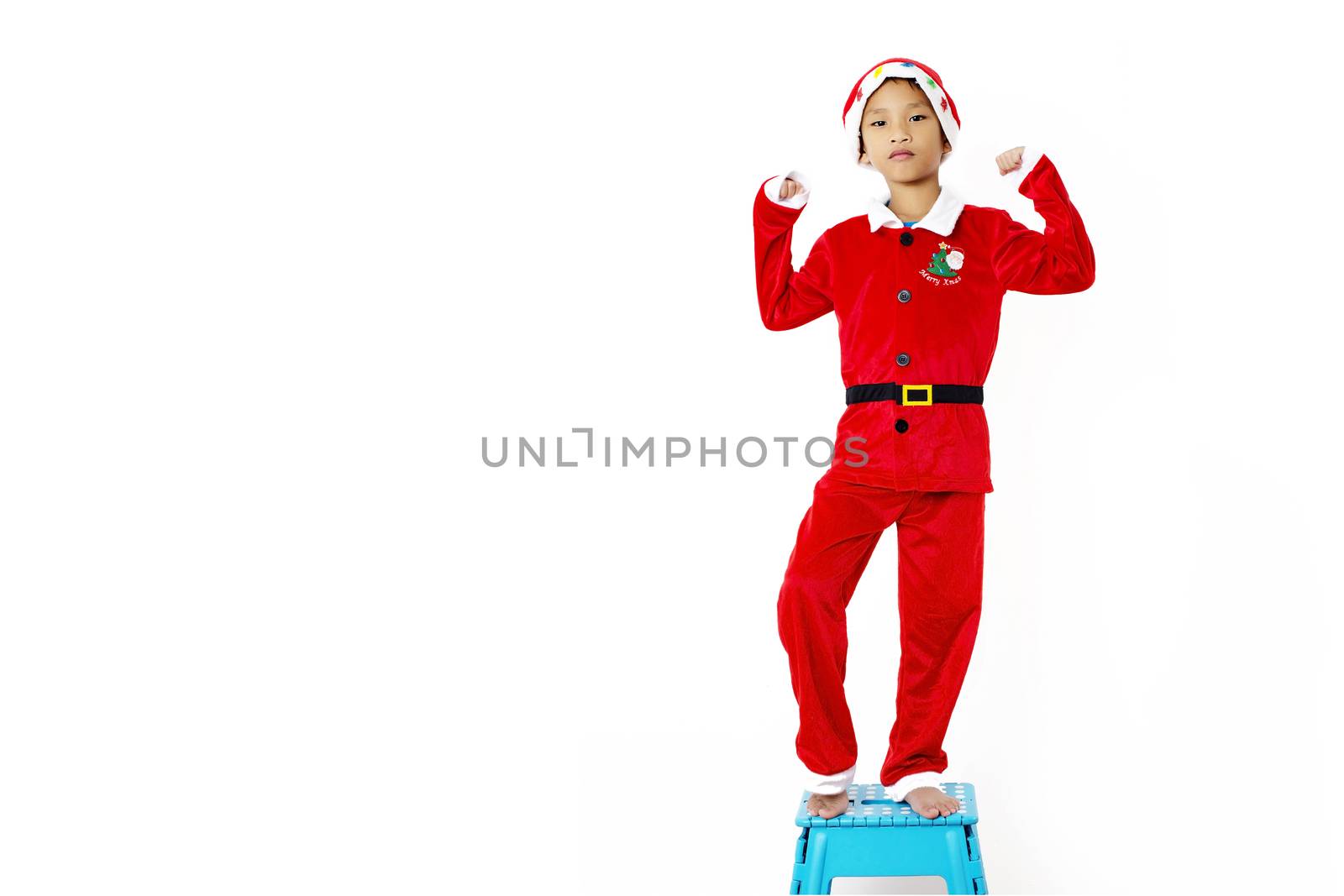 Asian little boy in red santa hat on white background by Yuri2012