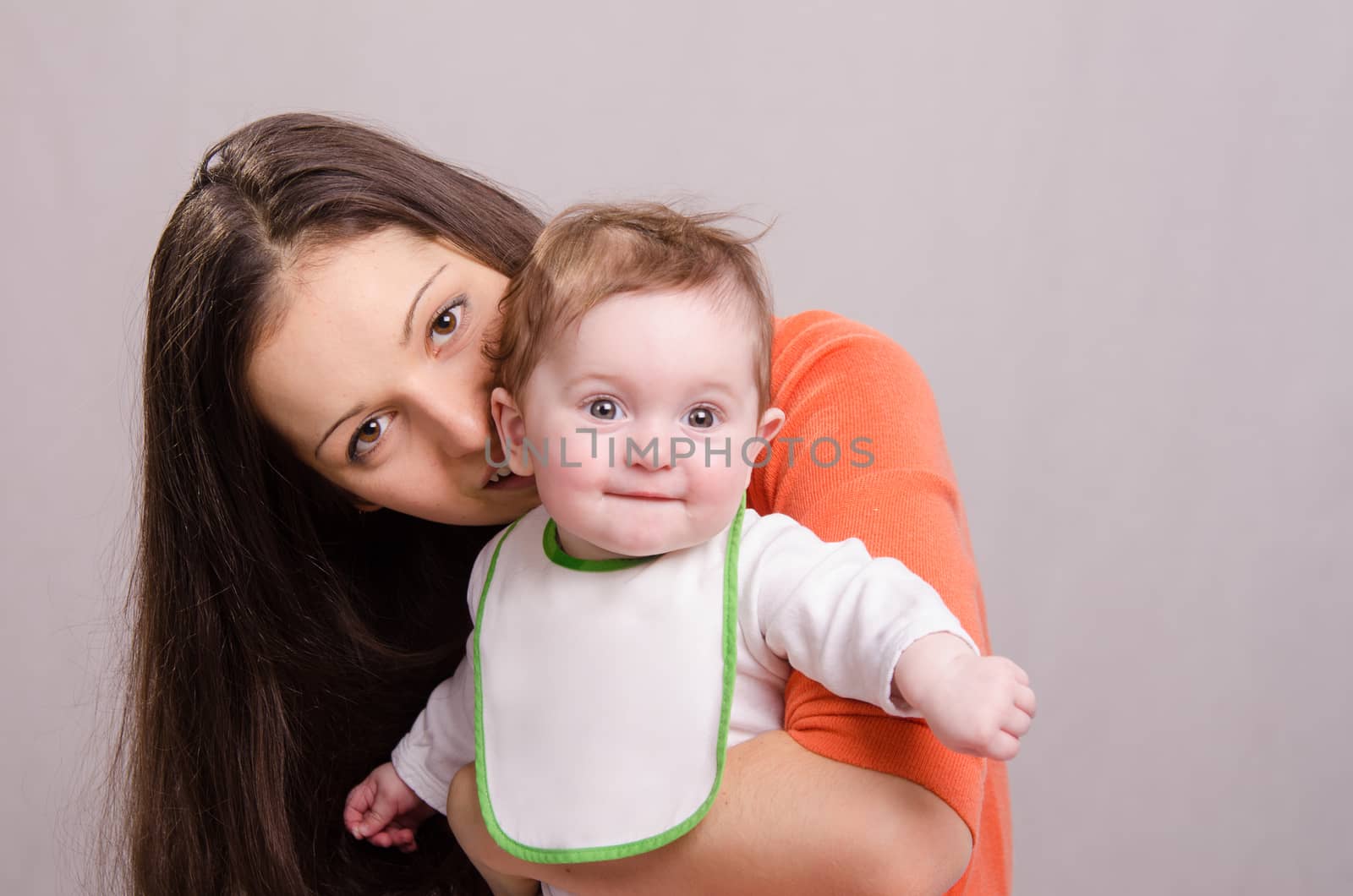 Portrait of mother and baby at the hands of six mothers