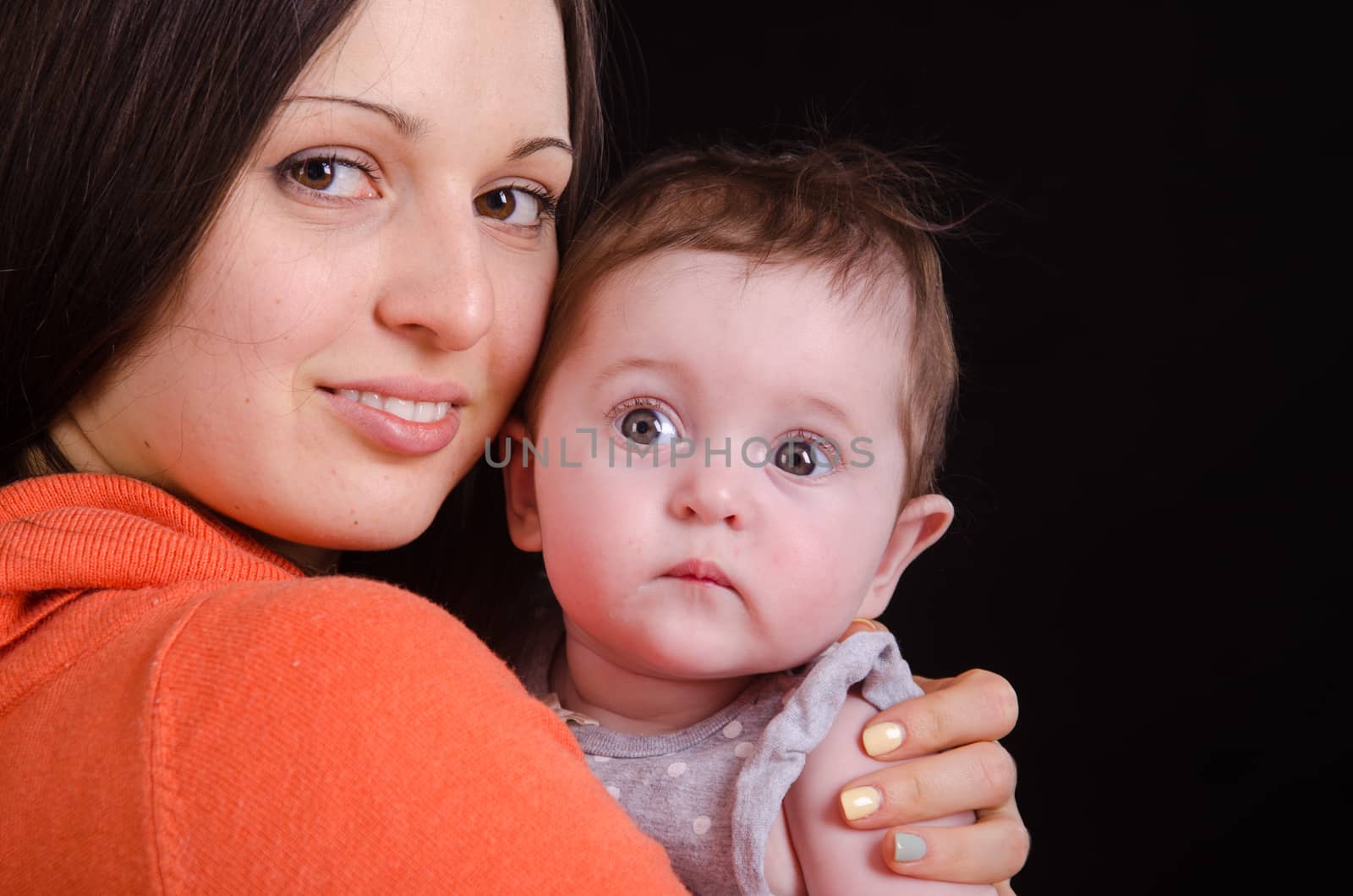 Portrait of mother and baby at the hands of six mothers