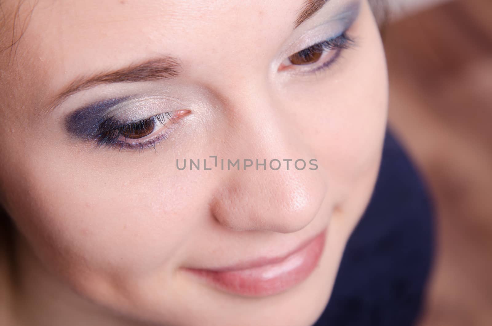Portrait of beautiful girl with bright makeup, makeup process