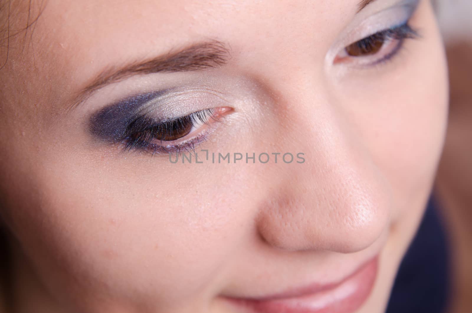 Portrait of beautiful girl with bright makeup, makeup process