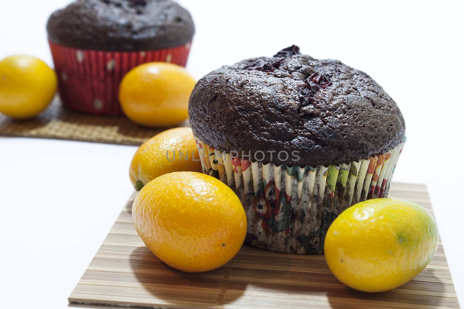 Chocolate muffins and kumquat by zlajaphoto