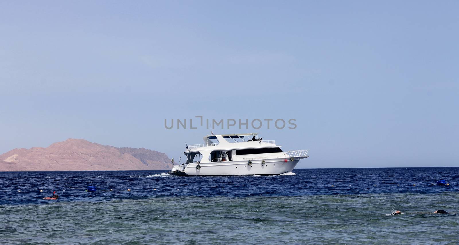 White Ship Moving By The Red Sea