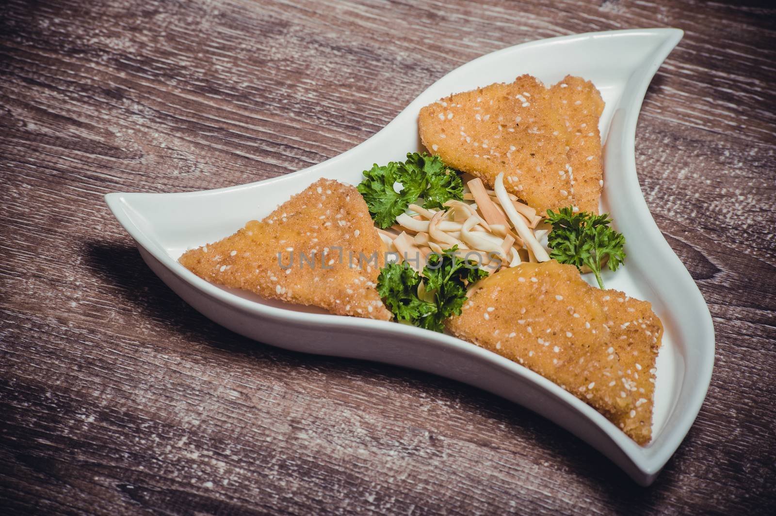 deep fried camamber cheese on white plate 