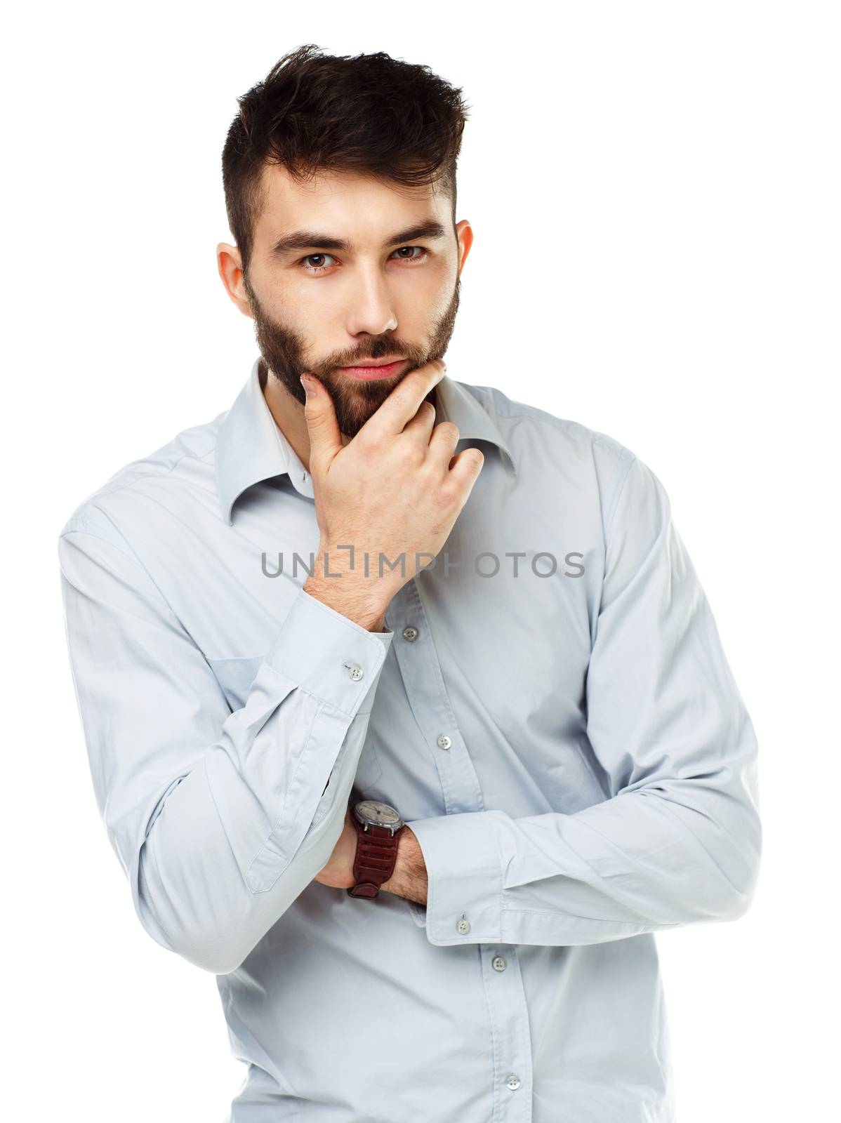 A young bearded man with a serious expression on his face isolated on white background