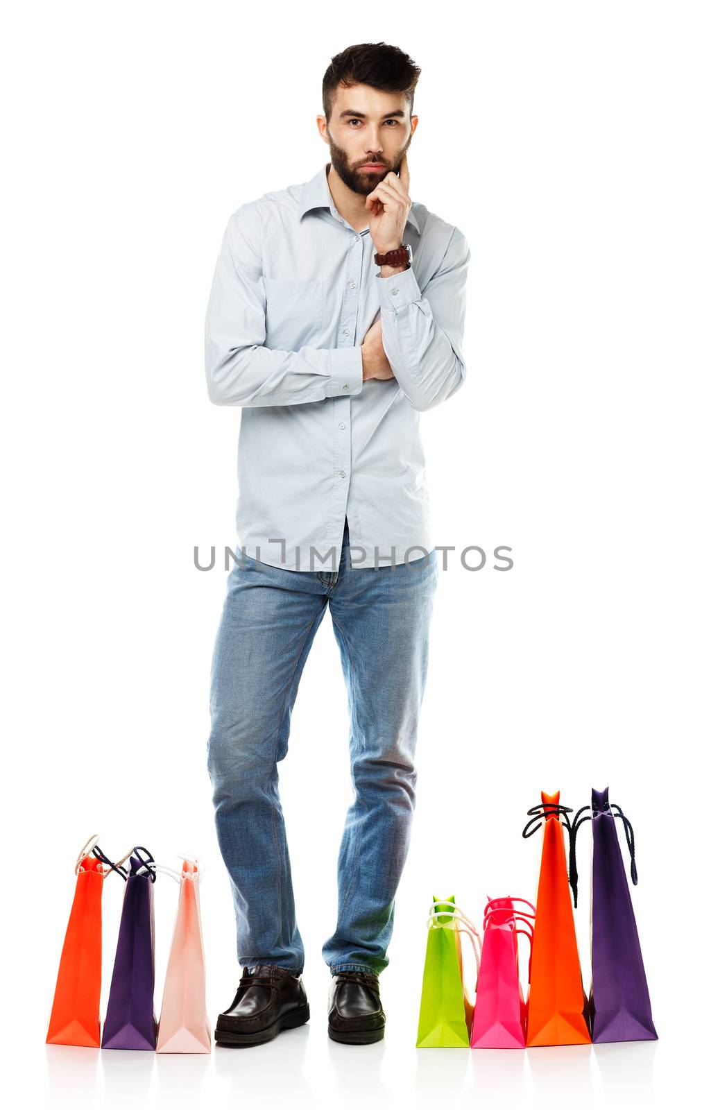 Handsome man with shopping bags. Christmas and holidays concept