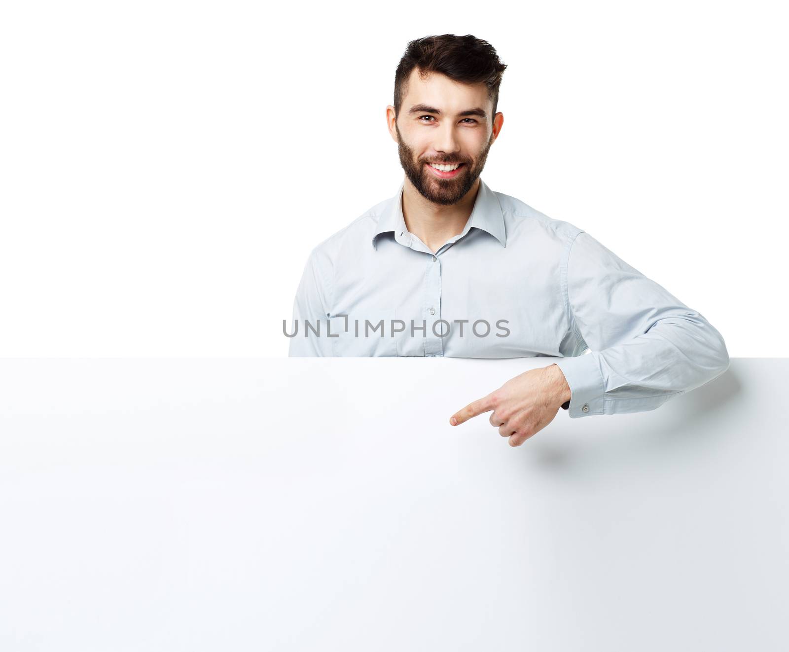 A young bearded man showing blank signboard, isolated over white by vlad_star