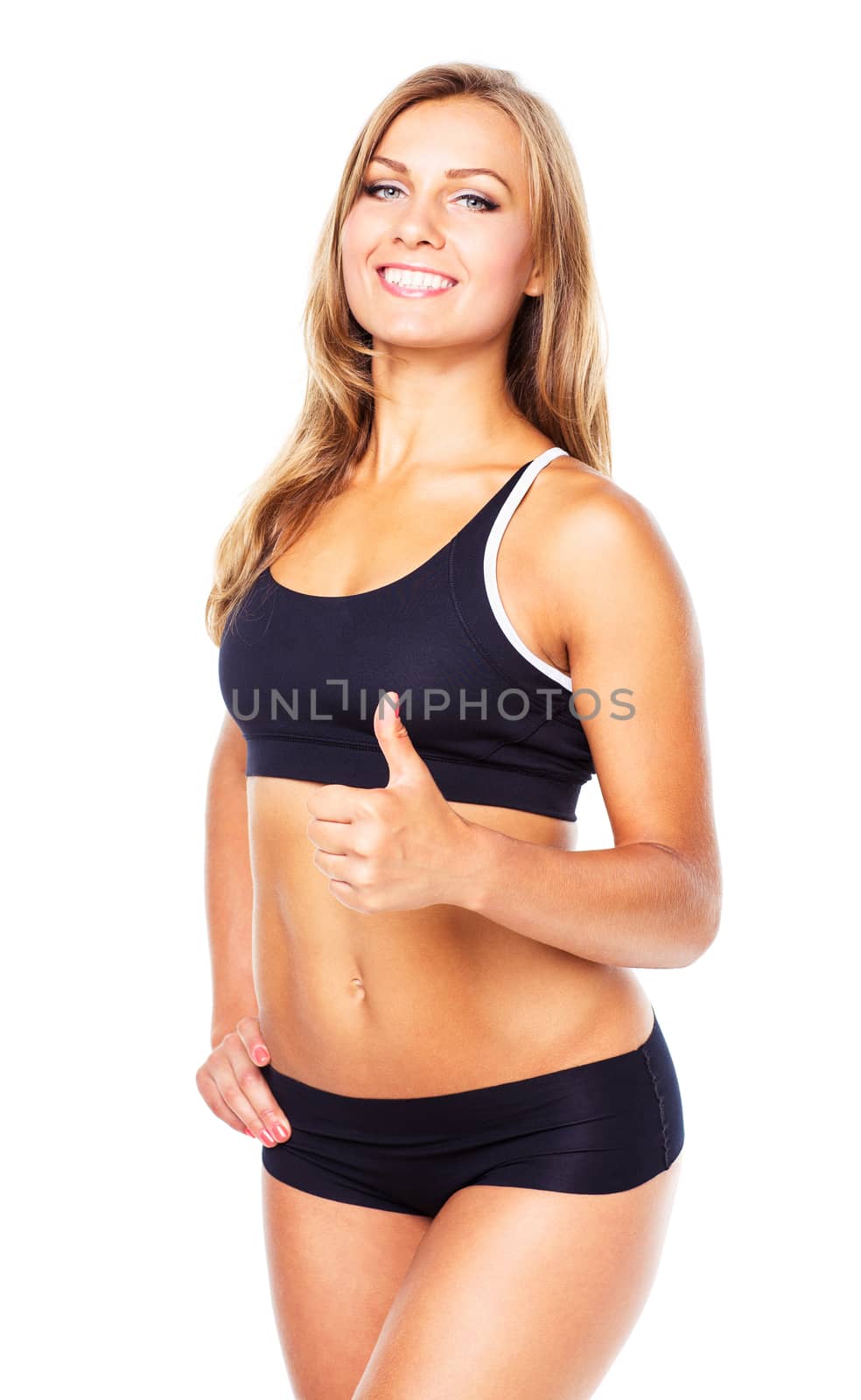Young athletic girl with a finger up on white background
