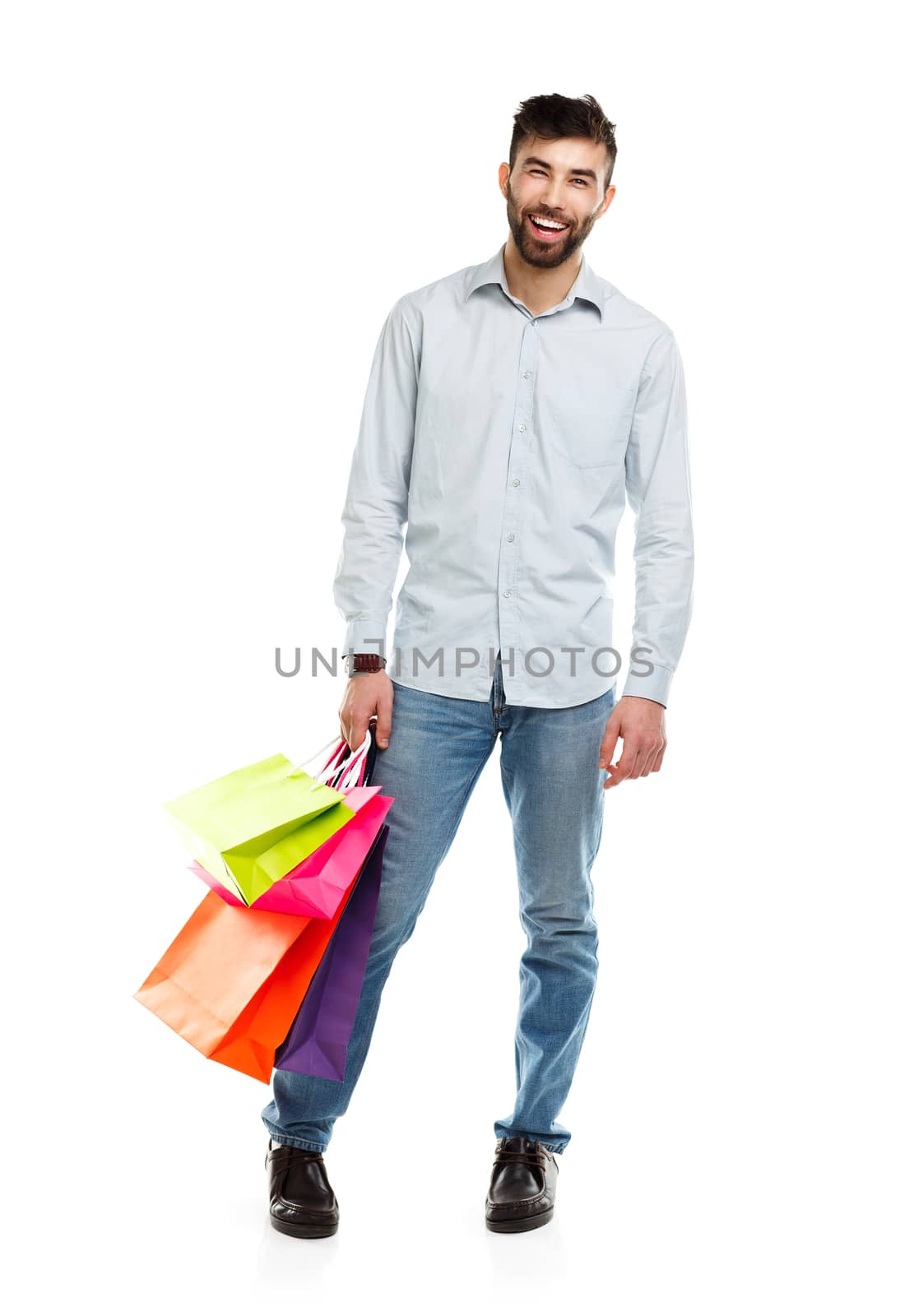 Man holding shopping bags. Christmas and holidays concept by vlad_star