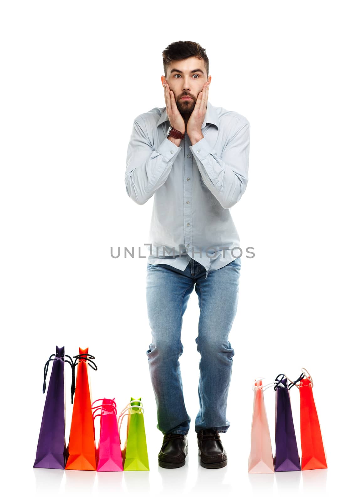 Handsome man with shopping bags. Christmas and holidays concept