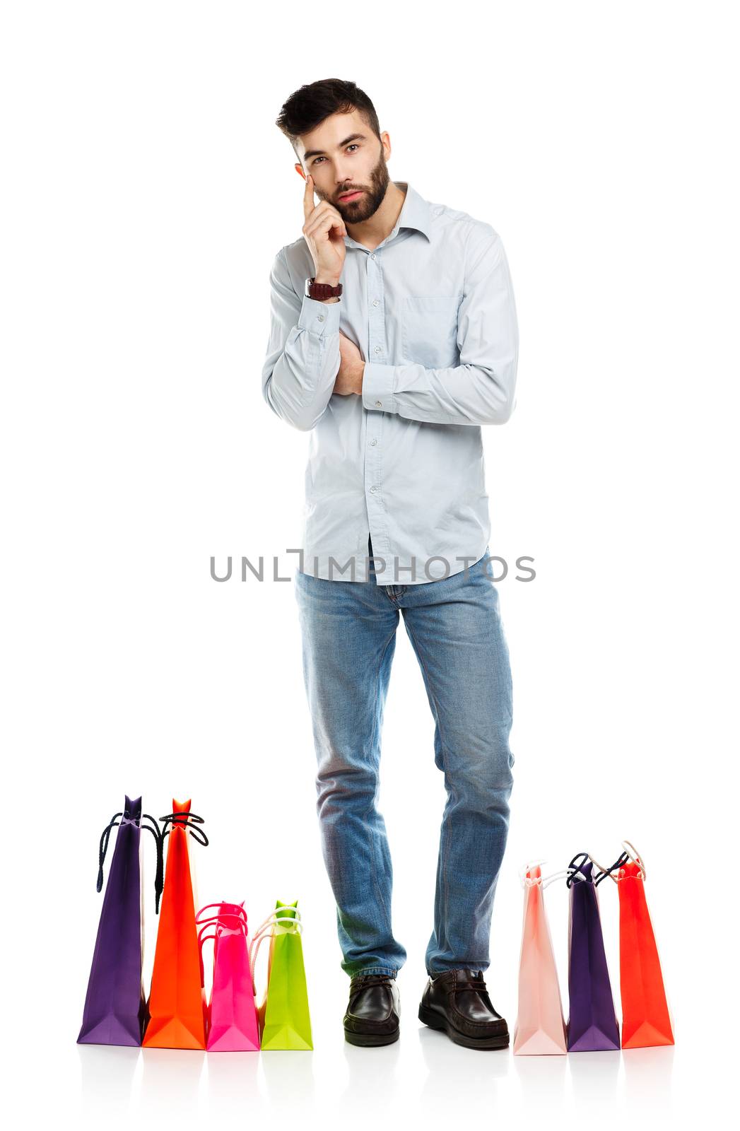Handsome man with shopping bags. Christmas and holidays concept
