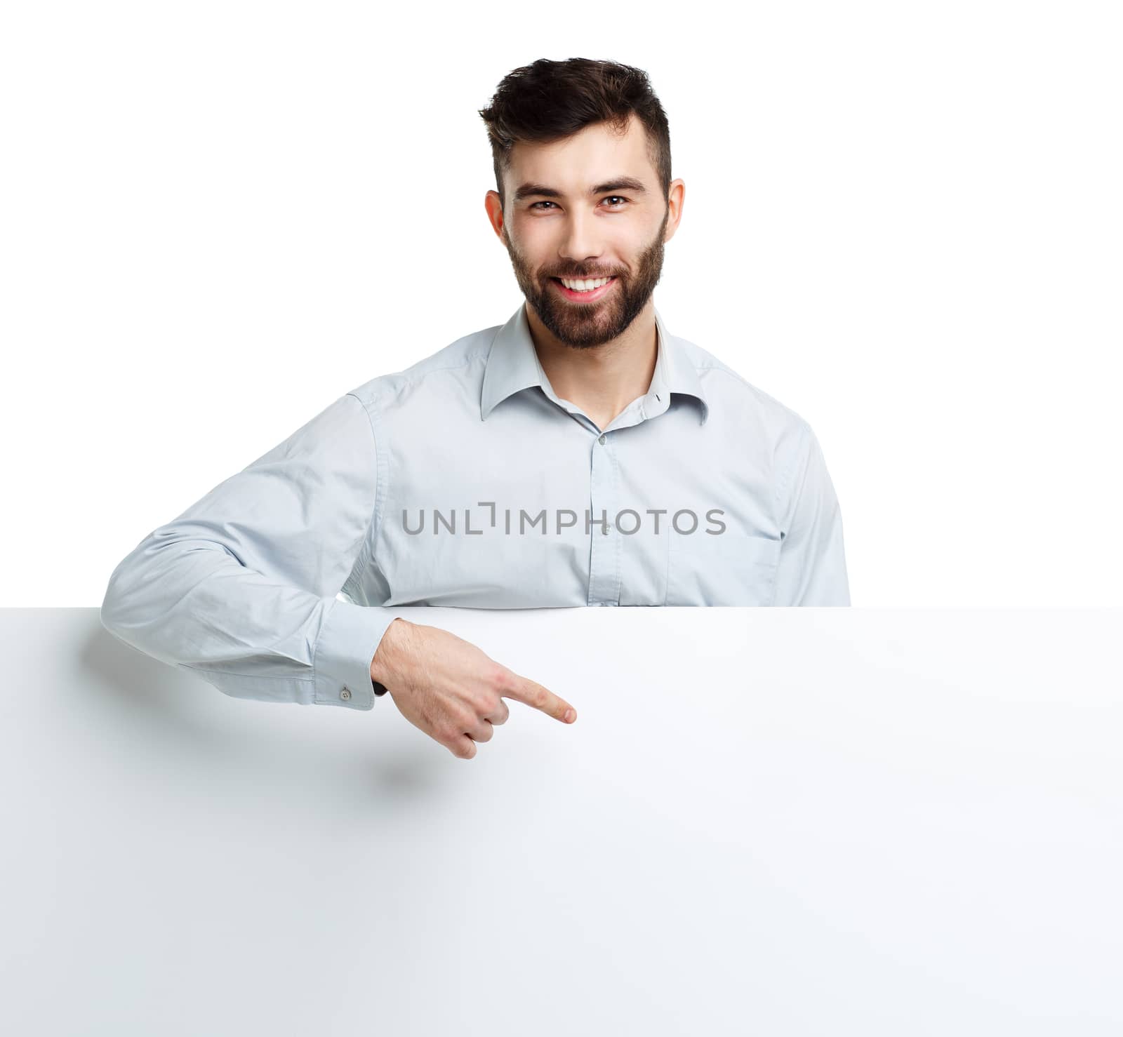 A young bearded man showing blank signboard, isolated over white background