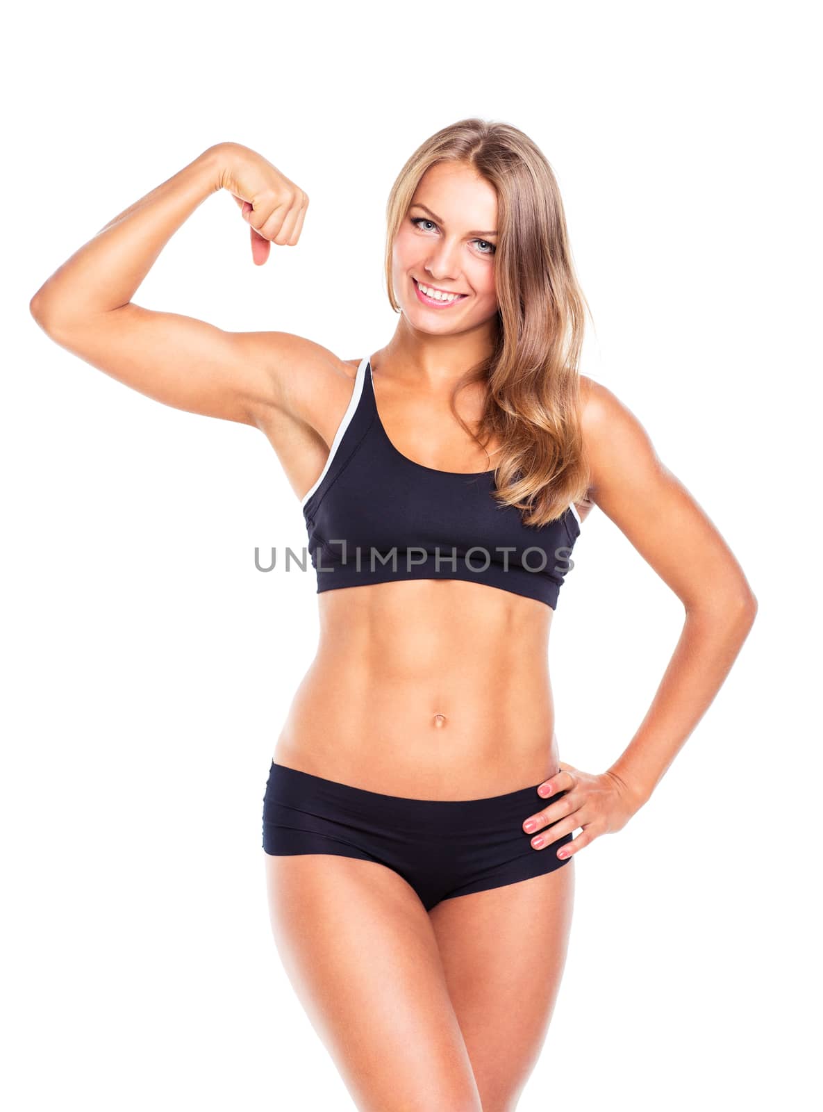 Young sports girl does exercises on a white background