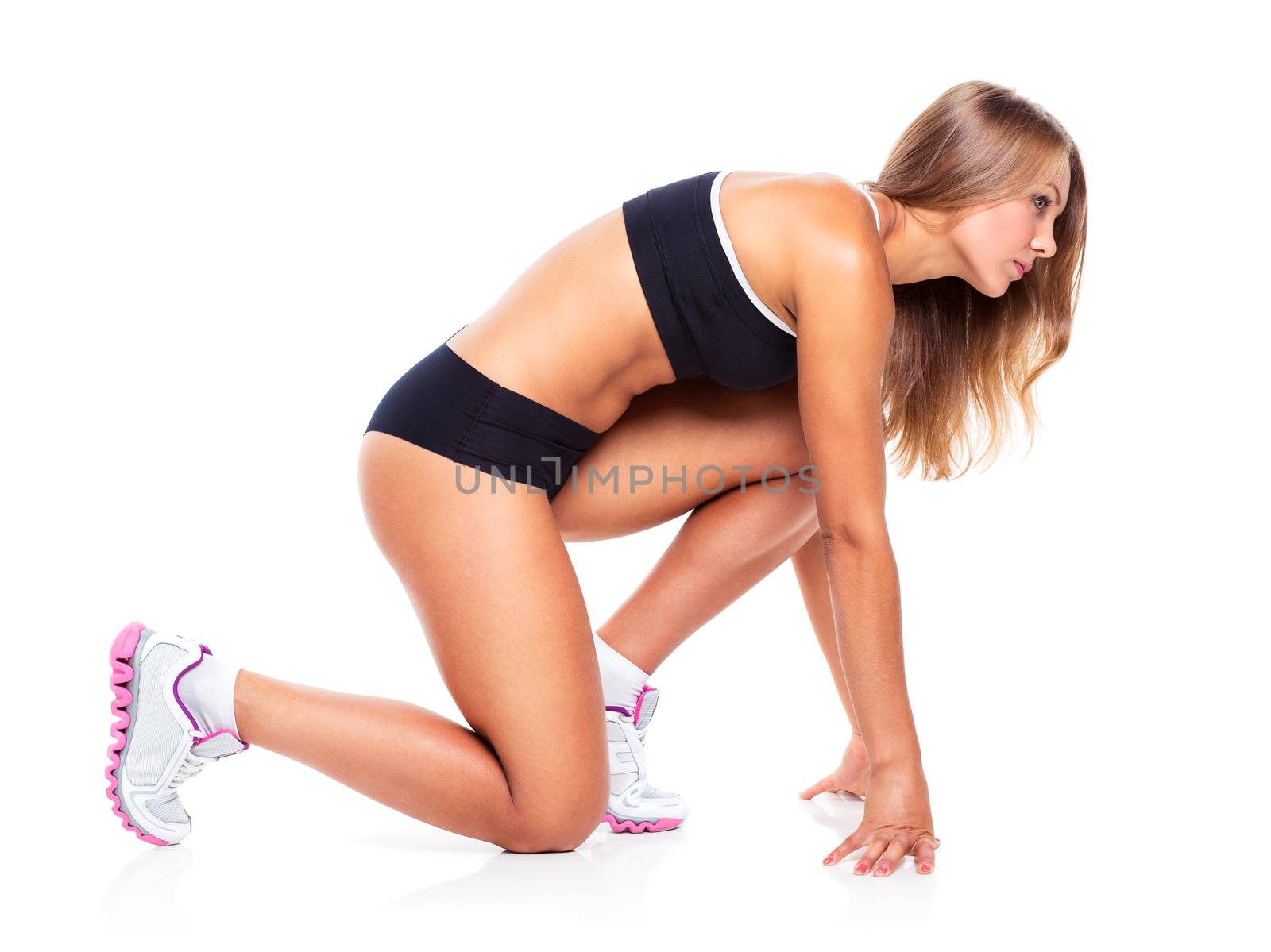 Young sports girl does exercises on a white by vlad_star