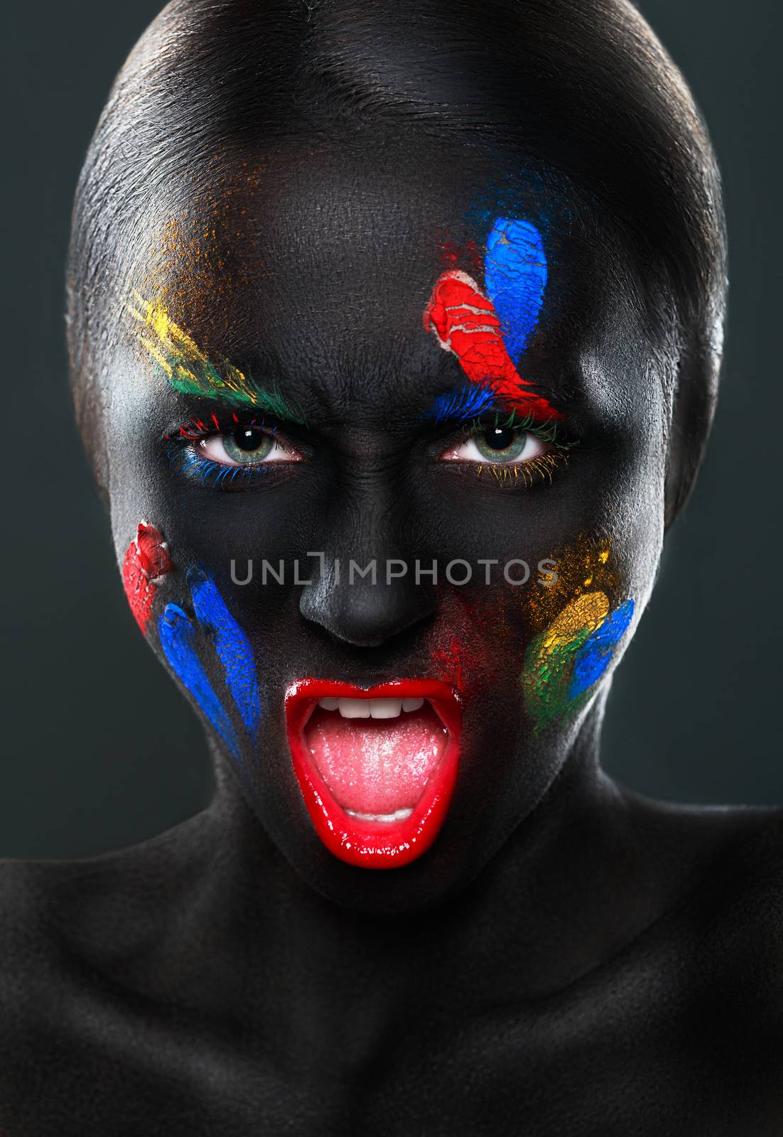 Portrait of a beautiful open-mouthed woman with black face by vlad_star