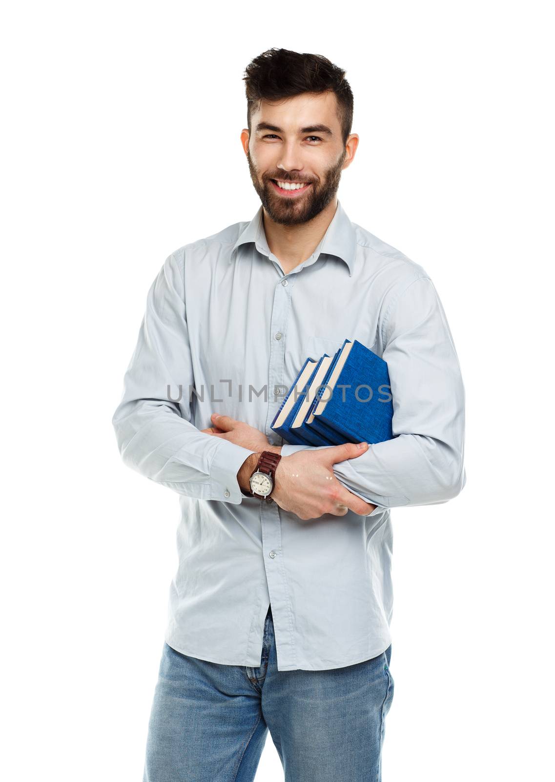Young bearded smiling man with books in hands on white background