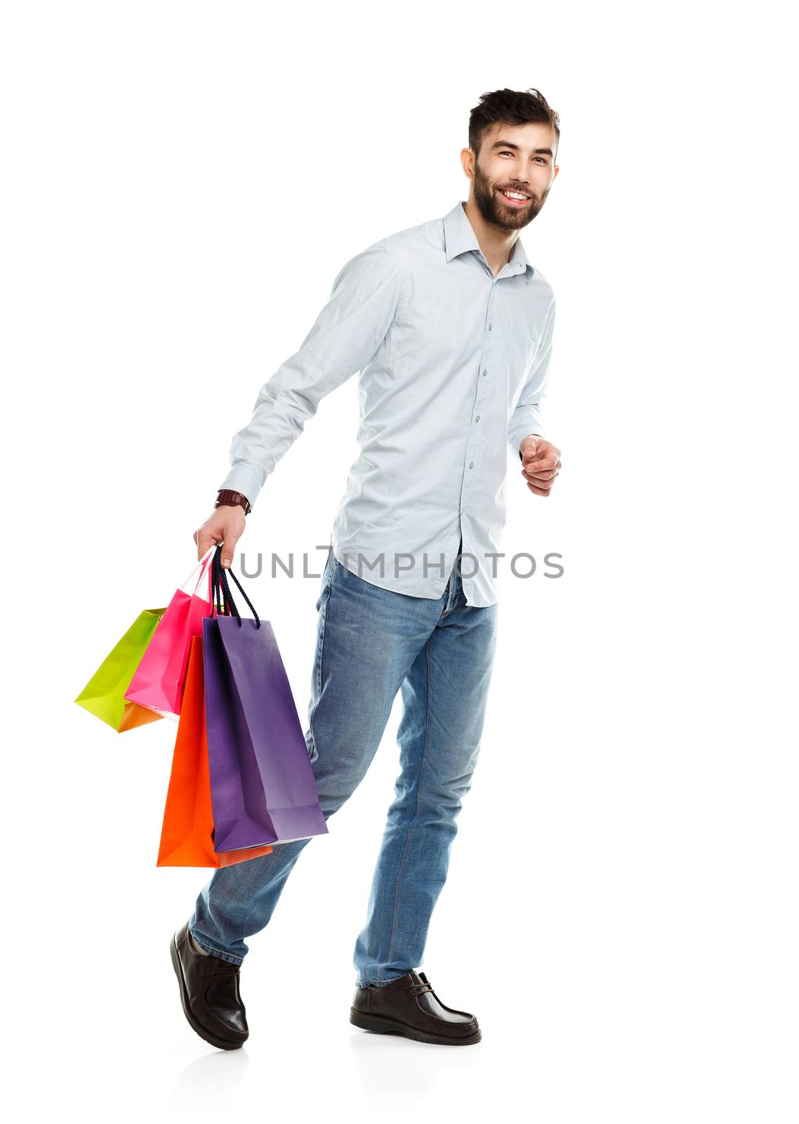 Handsome man holding shopping bags. Christmas and holidays concept