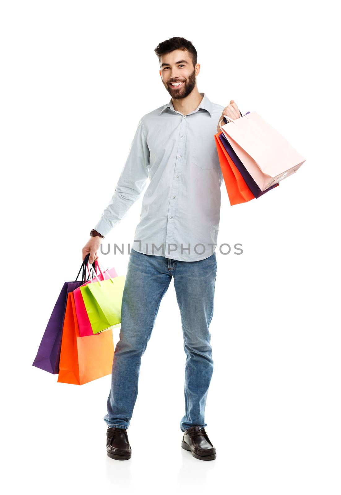 Handsome man holding shopping bags by vlad_star